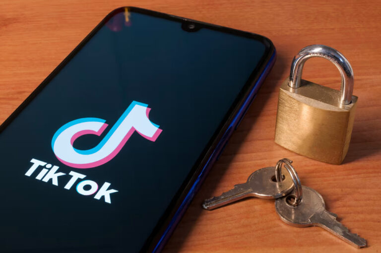 TikTok logo on mobile with keys and a lock in the background